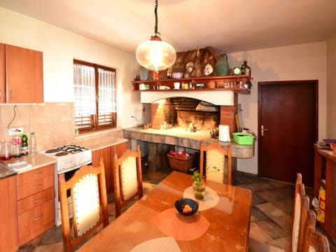 Furniture, Countertop, Table, Kitchen Appliance, Wood, Home Appliance, Kitchen, Orange, Kitchen Stove, Lighting