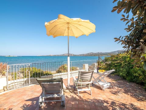 Water, Sky, Plant, Property, Umbrella, Azure, Shade, Outdoor Furniture, Body Of Water, Arecales