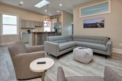 Spacious living room with sectional sofa and TV