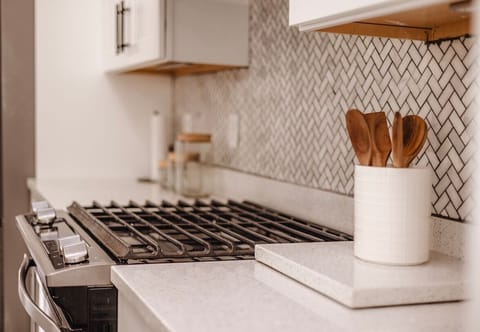 Gas range and stunning tile in the kitchen