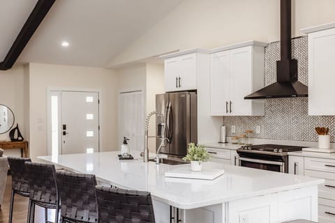 Fully equipped kitchen with seating at the bar