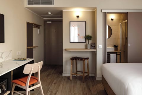 Deluxe Room, 1 Bedroom, City View | 1 bedroom, in-room safe, free WiFi, bed sheets