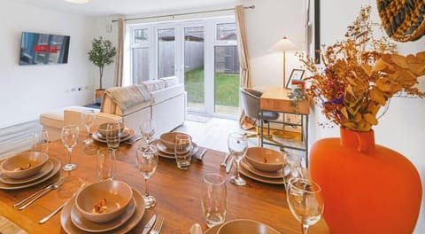 DINING TABLE WITH PLATES, GLASSES AND CUTLERIES