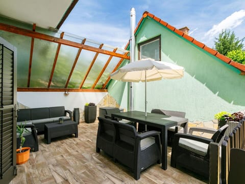 Sky, Cloud, Furniture, Property, Building, Couch, Plant, Table, Chair, Shade