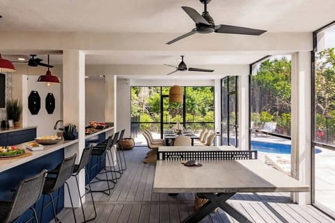 Welcome to the ultimate fun zone!  The bottom floor is a destination of its own. Enjoy a 6-top bar, large dining area, two dart boards, ping pong, lounge areas, brand new pool, yard games, grill and outdoor showers.  What more could you wish for?!