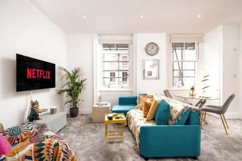 Step into a space that effortlessly blends comfort and modern design. Sink into the plush sofa and relax while enjoying the sophisticated ambiance created by the sleek decor and thoughtful touches. 