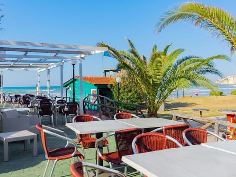 Sky, Table, Furniture, Property, Chair, Building, Shade, Water, Outdoor Furniture, Leisure