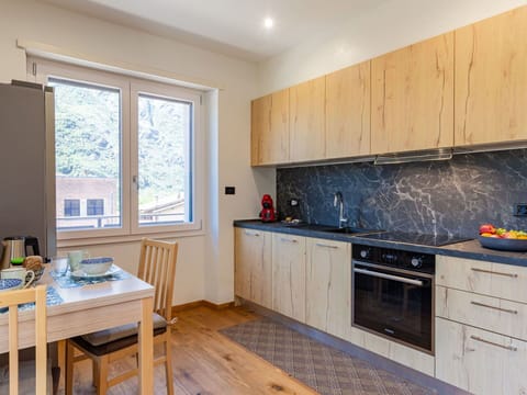 Cabinetry, Countertop, Property, Furniture, Building, Window, Kitchen Stove, Wood, Kitchen, Flooring