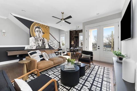 Overview of living room looking into dining area and 2nd floor terrace