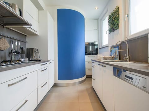 Countertop, Cabinetry, Property, Furniture, Kitchen, Kitchen Appliance, Interior Design, Building, Kitchen Stove, Wood