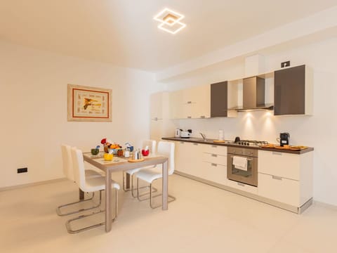 Furniture, Cabinetry, Building, Table, Countertop, Chair, Wood, Orange, Flooring, House