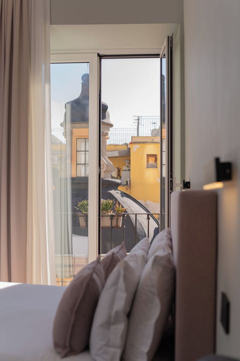 Camera Tripla Deluxe con balcone | In-room safe, desk, soundproofing, iron/ironing board