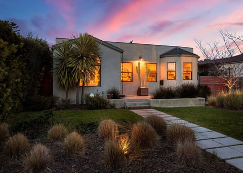 Where the golden glow of home meets the beauty of twilight—step inside and feel the warmth.