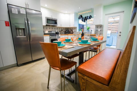 Enjoy your meals on this comfortable built in booth and comfy chairs 