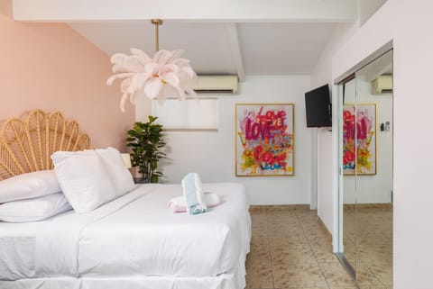 The Barbie Suite is Styled to Inspire. Wake up happy in this Palm Springs room! Enjoy the king-size comfort, playful pink decor, and immediate patio views.Surround yourself with vibrant décor and luxe touches—your perfect desert escape starts here.
