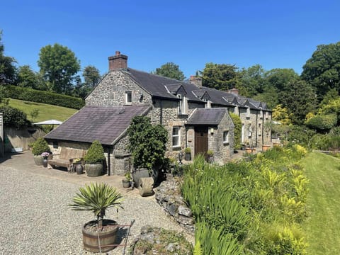 Exterior of Fiddlers Green Cottage, gardens, gravel area