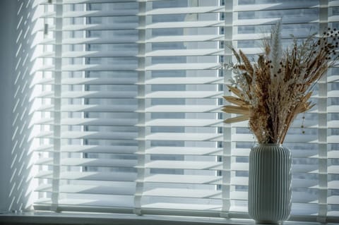 View of window with a flower vase