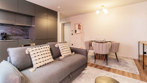 Relax in the cozy living area, featuring comfortable seating and soft lighting, perfect for lounging with a book or watching your favorite shows. #relax #airbnb