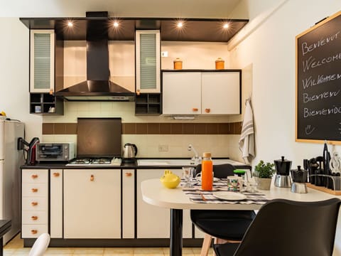 Cabinetry, Property, Countertop, Furniture, Kitchen, Chair, Home Appliance, Lighting, Interior Design, Kitchen Stove