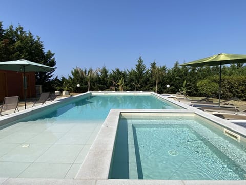 Sky, Plant, Tree, Shade, Swimming Pool, Outdoor Furniture, Urban Design, House, Landscape, Grass