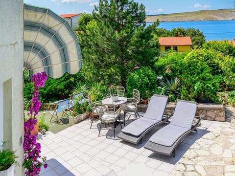Plant, Property, Sky, Flower, Building, Outdoor Furniture, Architecture, Chair, Shade, Cloud