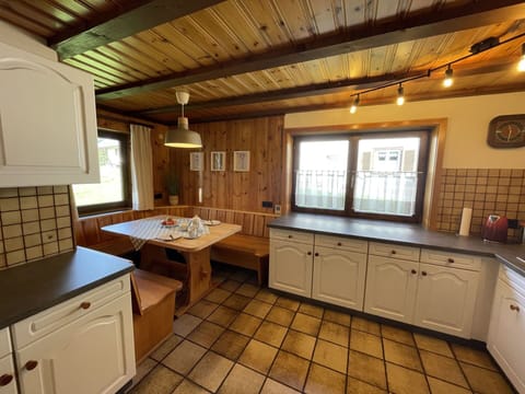 Cabinetry, Property, Furniture, Sink, Tap, Window, Countertop, Wood, Lighting, Kitchen