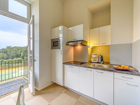 Cabinetry, Property, Countertop, Building, Kitchen Appliance, Kitchen Stove, Tap, Wood, Home Appliance, Lighting