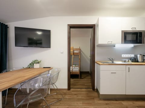 Furniture, Cabinetry, Building, Table, Wood, Countertop, Flooring, Floor, Wood Stain, Door