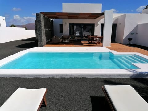 Water, Sky, Property, Furniture, Swimming Pool, Building, Azure, Shade, Rectangle, Outdoor Furniture