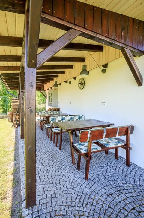 Table, Property, Furniture, Wood, Building, Outdoor Table, Shade, Floor, Plant, Hardwood