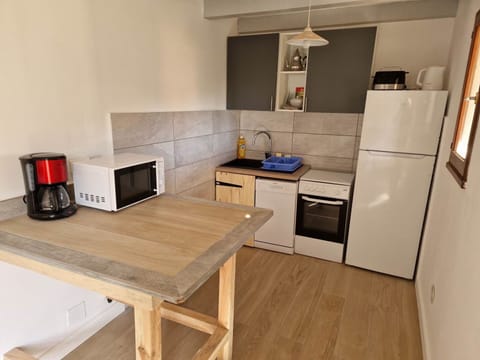 Furniture, Cabinetry, Property, Table, Countertop, Wood, Interior Design, Home Appliance, Flooring, Kitchen Stove