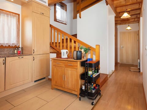 Furniture, Flooring, Wood, Interior Design, Floor, Cabinetry, Ceiling, Kitchen, Room, Lighting