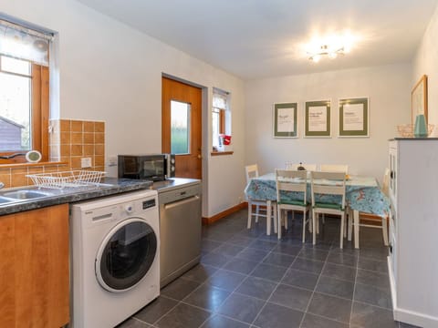 Furniture, Property, Cabinetry, Countertop, Plumbing Fixture, Kitchen Stove, Wood, Kitchen Appliance, Picture Frame, Lighting