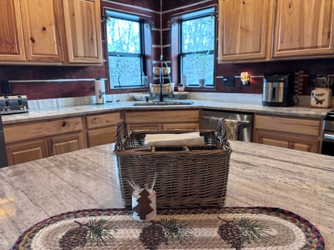 Corner windows above sink offer view. Modern appliances-Airfryer, 4slot Toaster