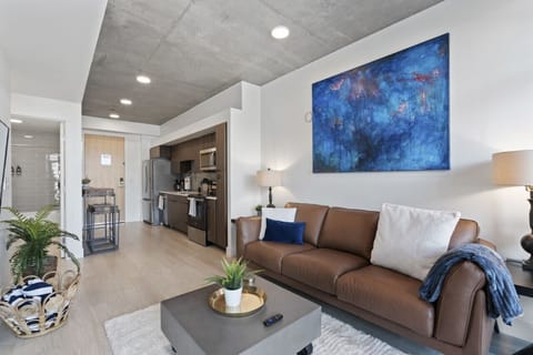 Luxury leather sofa with custom local art! Relax in style with all that you need!