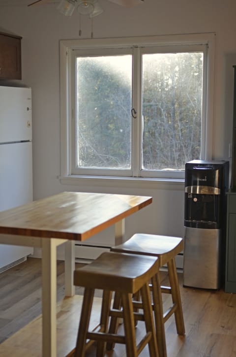 Soothing light and a gentle view to start the day, with seating for two at the kitchen island.