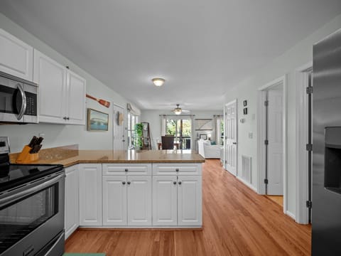 Primary bedroom/bath is located off of the kitchen on the right