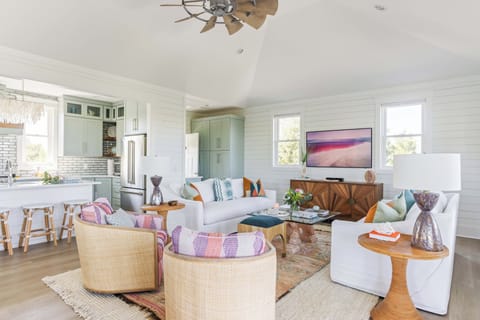 Professionally decorated living room with picture TV and lots of seating!