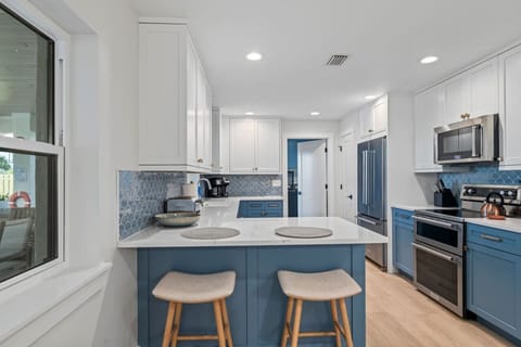 Fully equipped kitchen with island seating at Taj Duval Jacksonville Beach