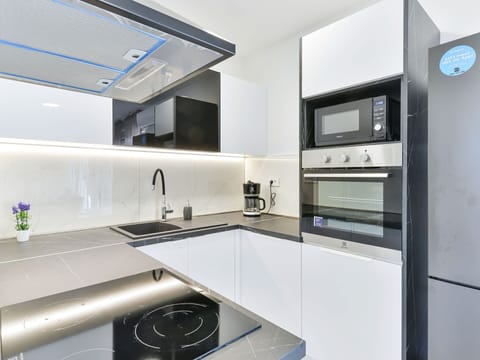 Countertop, Cabinetry, Tap, Property, Sink, Kitchen Sink, Furniture, Kitchen, Kitchen Stove, Plumbing Fixture