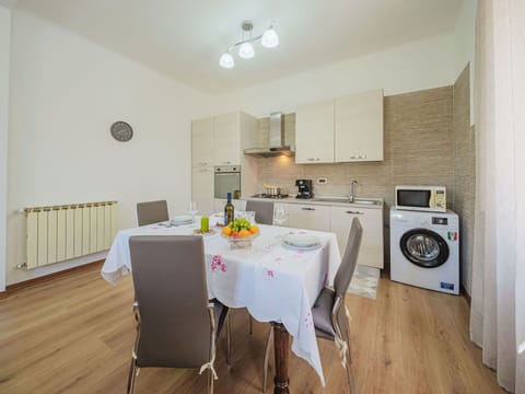 Furniture, Cabinetry, Table, Chair, Building, Lighting, Laundry Room, Wood, Interior Design, Flooring