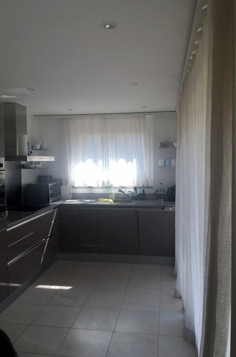 Cabinetry, Curtain, Wood, Floor, Flooring, Building, Countertop, Shade, Kitchen, Ceiling