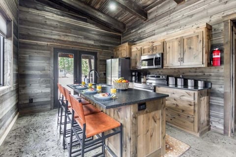 Step into our sleek kitchen oasis, where modern design meets culinary convenience. With its spacious layout and gleaming countertops, this kitchen is a chef's dream.