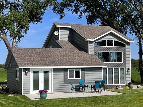 Tranquil lakeside escape steps away from your own Lake Herman beach. 