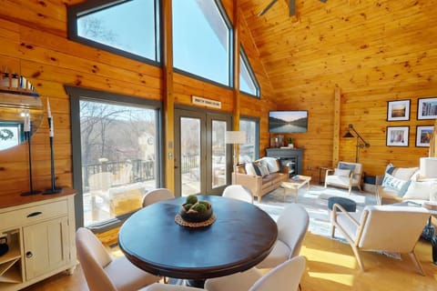 Round dining table for 6 in a warm spot by the kitchen and living room.