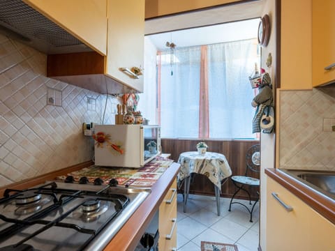 Furniture, Cabinetry, Property, Countertop, Table, Gas Stove, Chair, Kitchen, Interior Design, Kitchen Stove