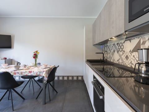 Table, Cabinetry, Kitchen Stove, Gas Stove, Kitchen Appliance, Interior Design, Lighting, Countertop, Building, Wood