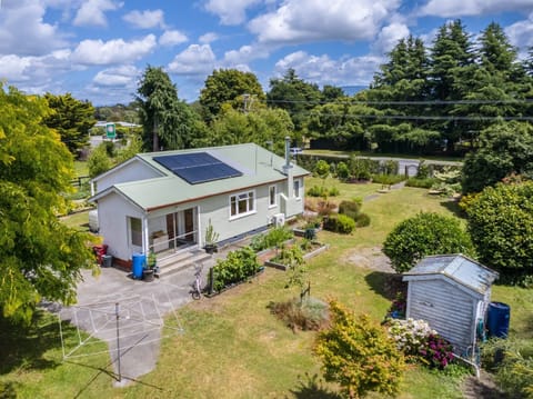 Solar powered home in rural setting, close to amenities.