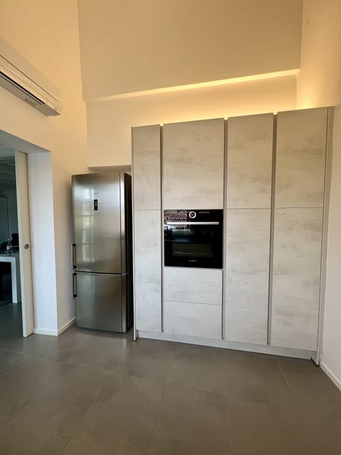 Large fridge and much pantry space, cookware and dining sets for everyone
