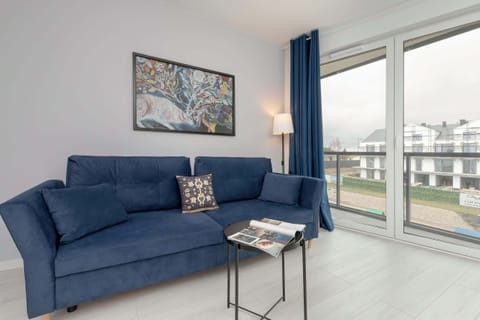 A tasteful blue sofa bed, ideal for relaxing after a busy day.